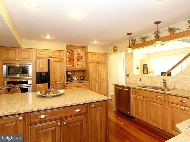 8 Midsummer Court Gaithersburg, MD 20878 - Photo 9 of 30 a kitchen with a sink and cabinets