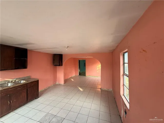 a view of a kitchen with wooden floor and breakfast area