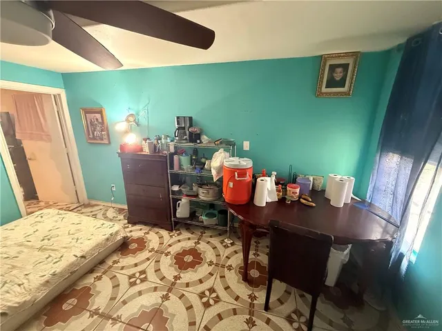 a bedroom with a bed and a table in it