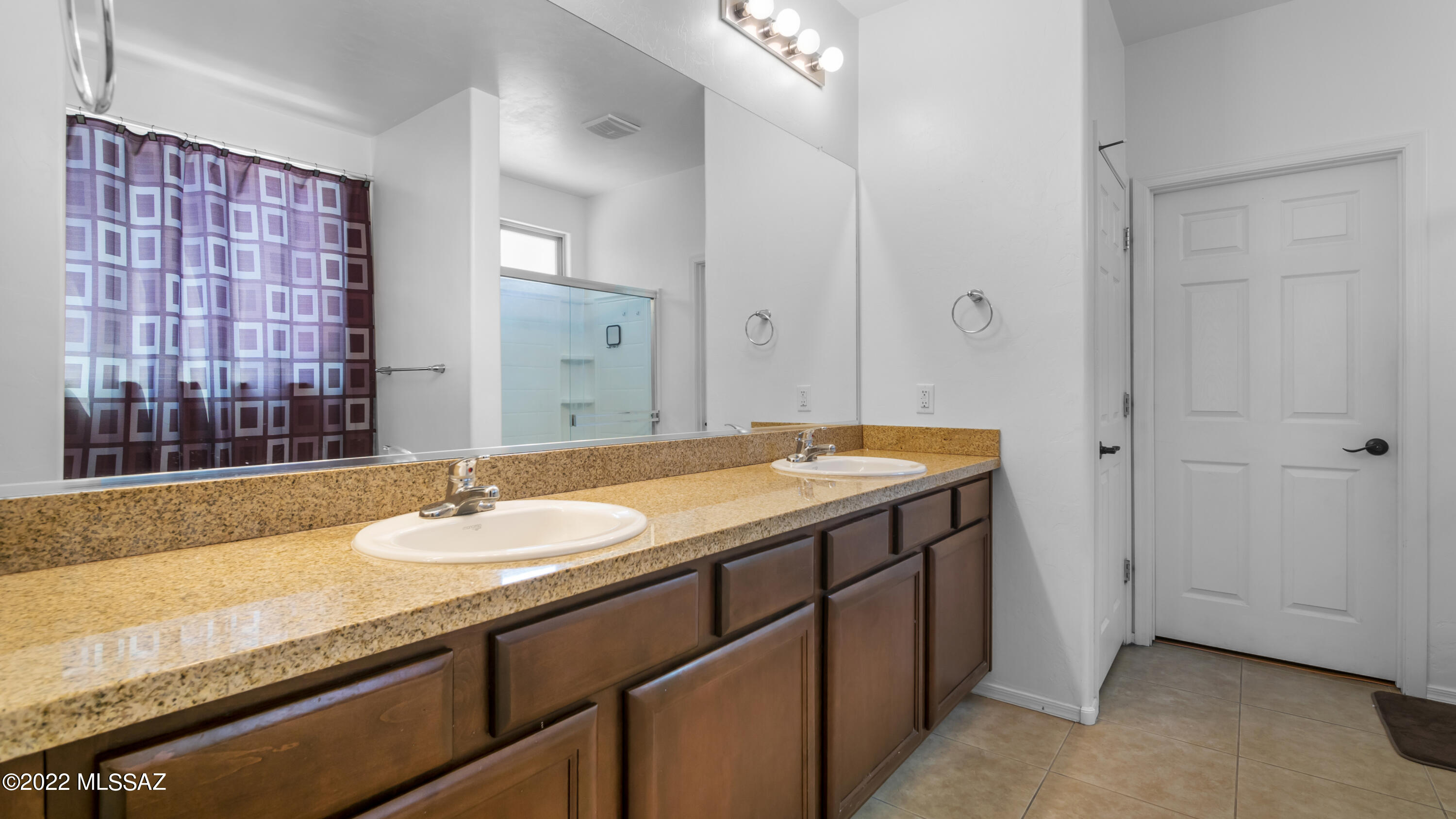 1081 Vista De Los Alamos Rio Rico, AZ 85648 - Photo 22 of 45 a bathroom with a sink and a mirror