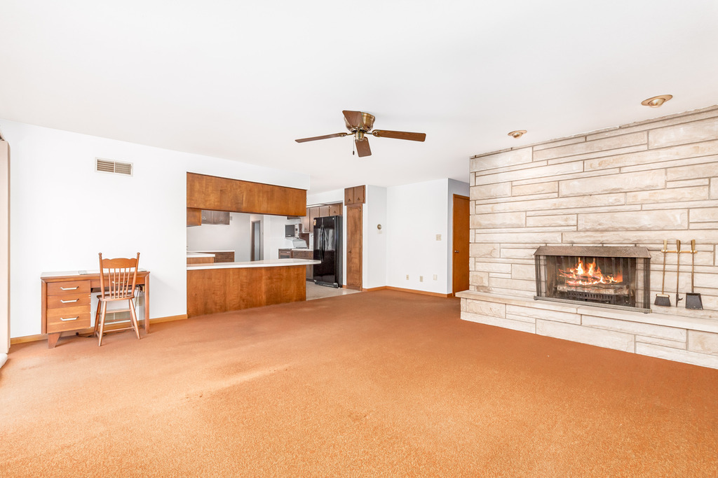 2603 Caton Farm Road Joliet, IL 60435 - Photo 5 of 22 a living room with furniture and a fireplace