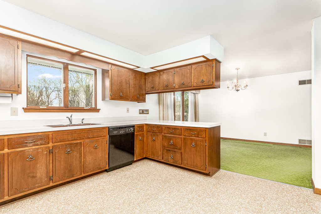 2603 Caton Farm Road Joliet, IL 60435 - Photo 8 of 22 a kitchen with stainless steel appliances granite countertop a sink and a stove next to a window