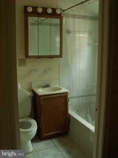 1206 Greystone Road Halethorpe, MD 21227 - Photo 1 of 10 a bathroom with a sink a toilet and shower