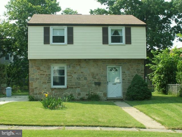 1206 Greystone Road Halethorpe, MD 21227 - Photo 10 of 10 a front view of a house with a yard