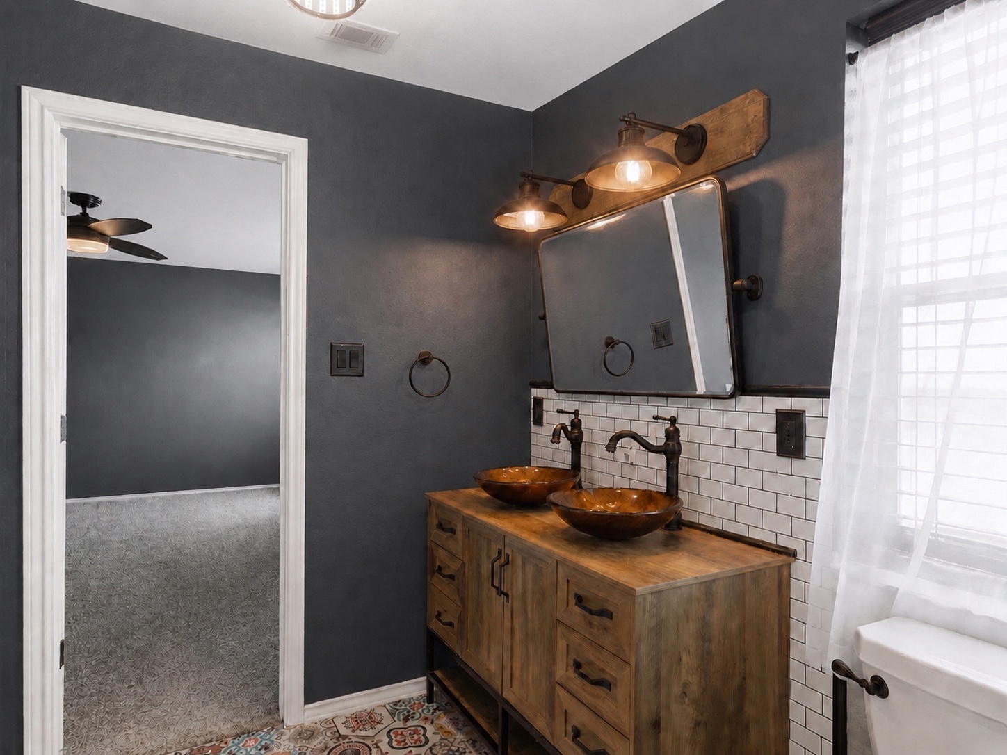 116 Night Riders Way Jarrell, TX 76537 - Photo 20 of 37 Double vessel sinks and subway tile backsplash elevate this stylish bathroom's design.