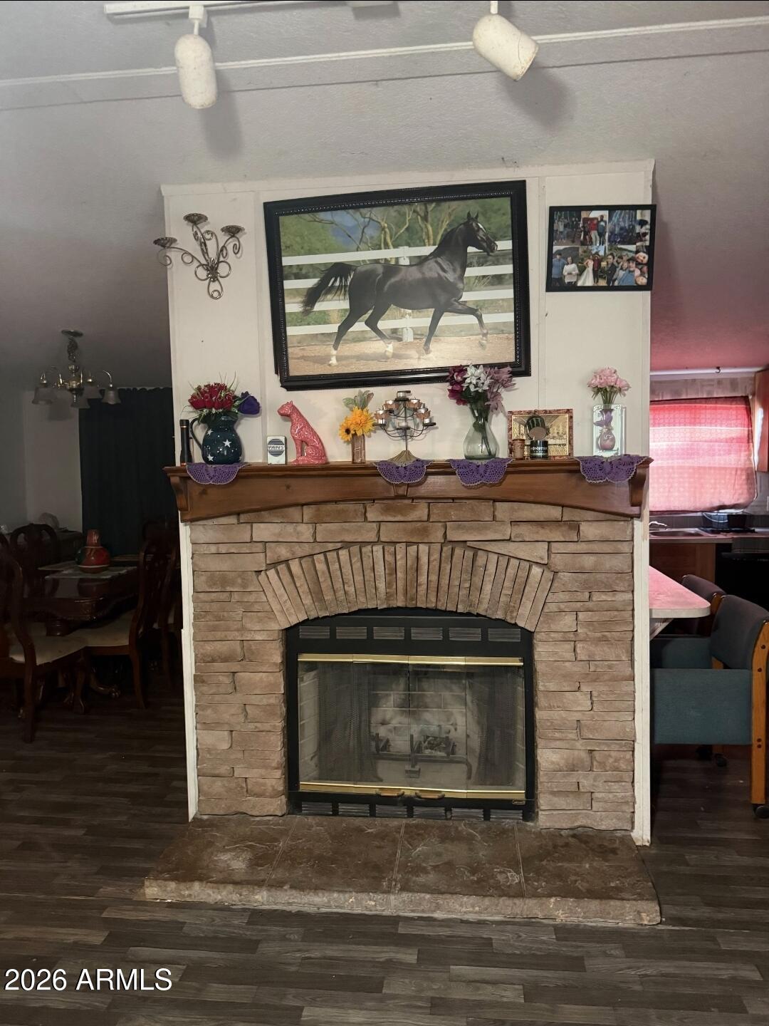 2625 Saddle Vista Road Tonopah, AZ 85354 - Photo 3 of 19 a fireplace with a clock on top of it
