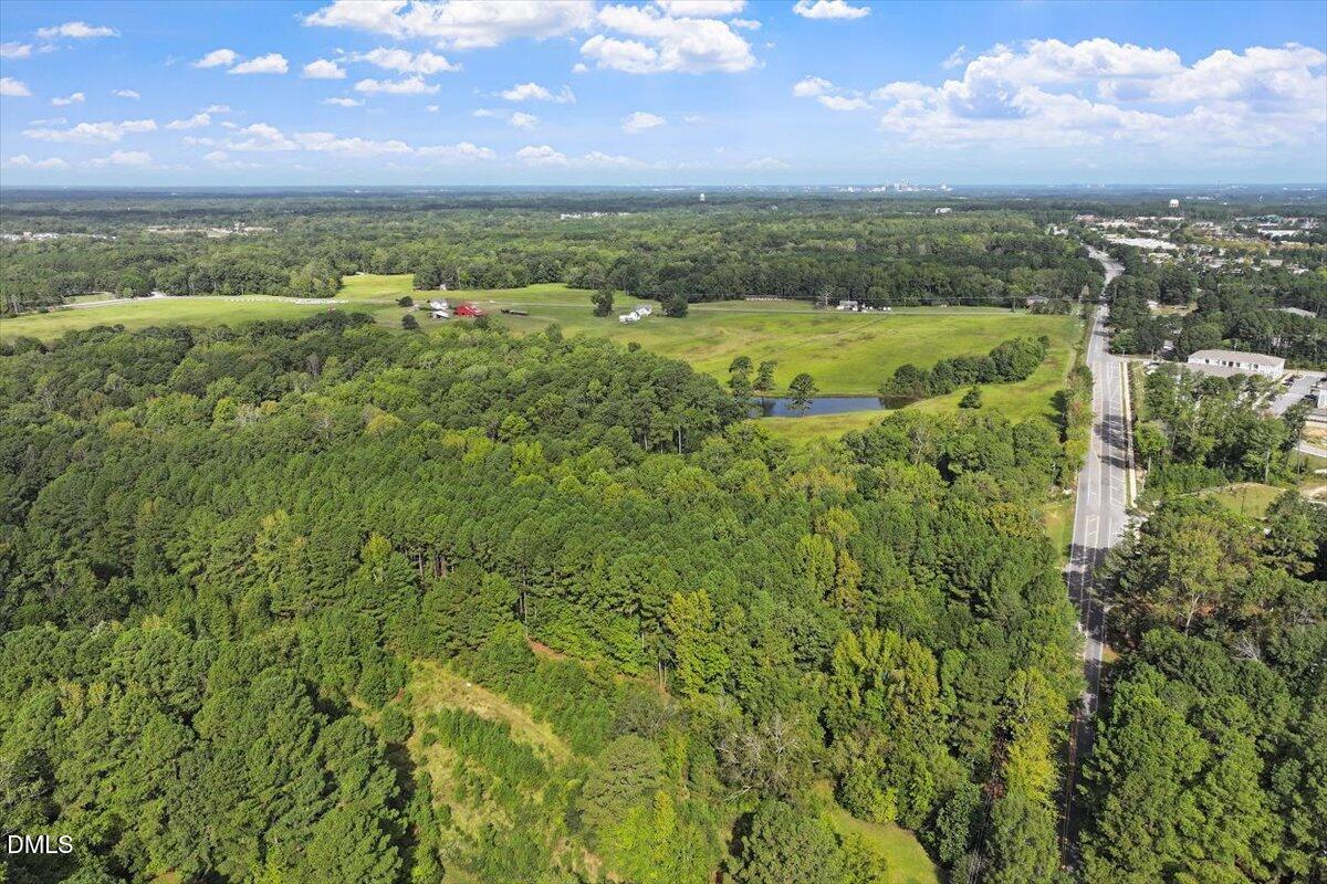 7626 White Oak Road Garner, NC 27529 - Photo 11 of 12 a view of a city with lush green forest