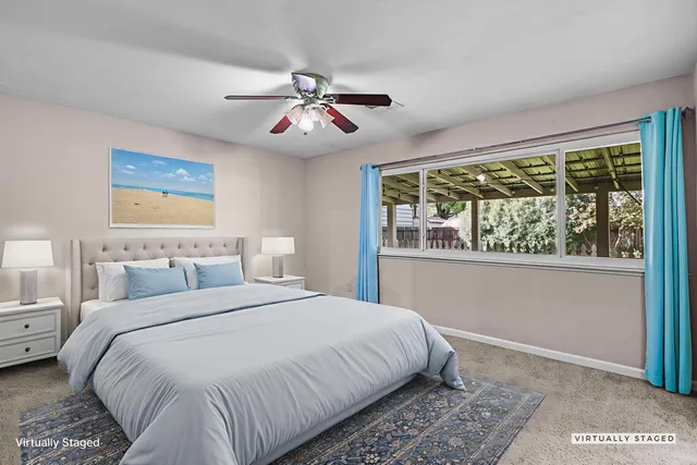 a bedroom with bed and window