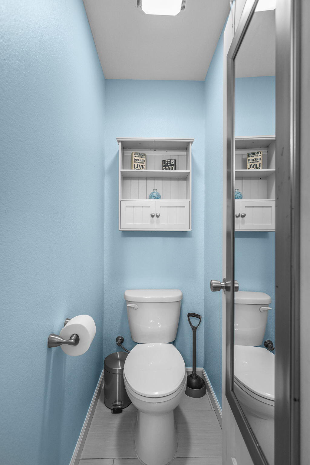 4218 Jane Street Redding, CA 96002 - Photo 16 of 50 a white toilet sitting next to a bathroom sink