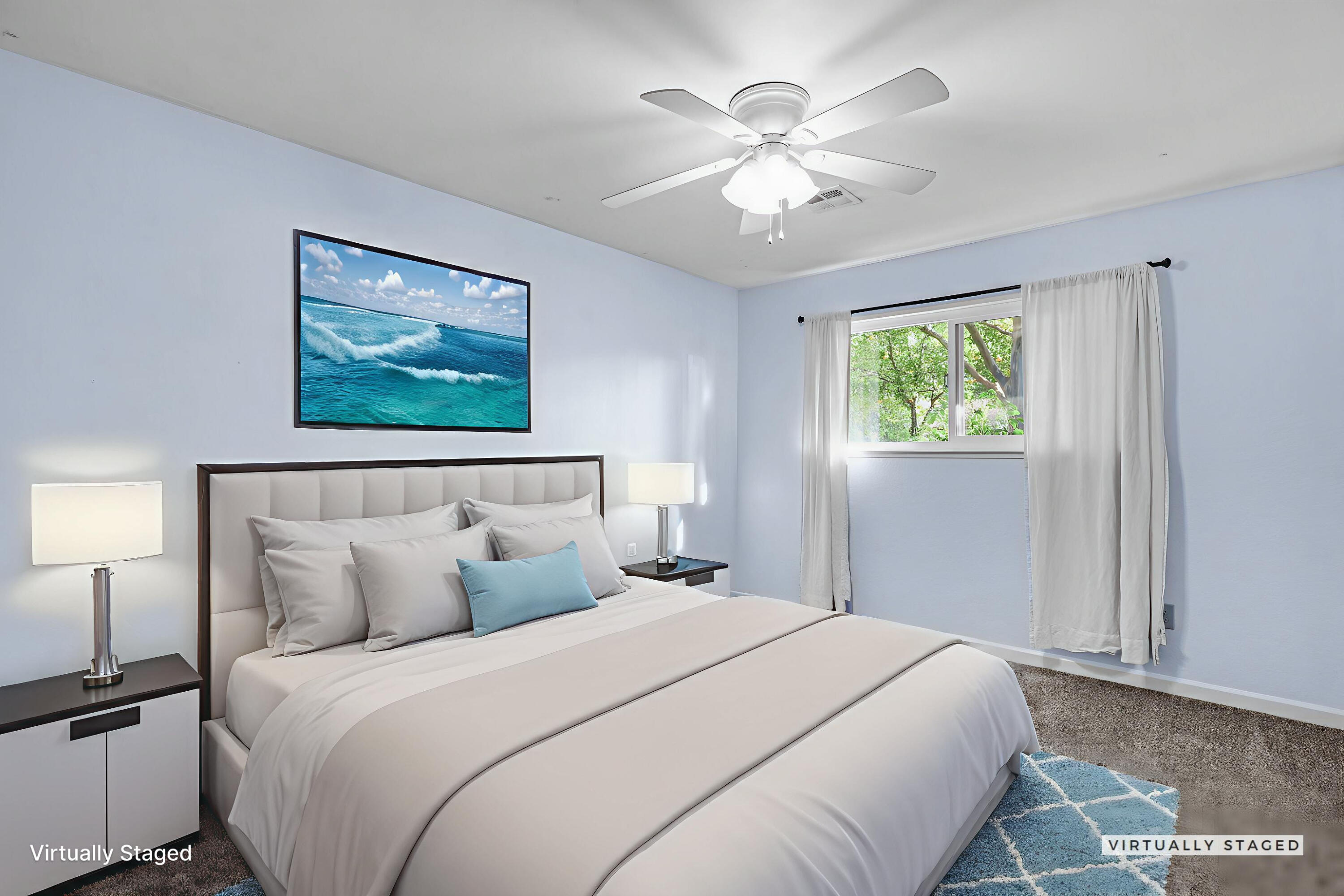 4218 Jane Street Redding, CA 96002 - Photo 26 of 50 a bedroom with a large bed and a chandelier