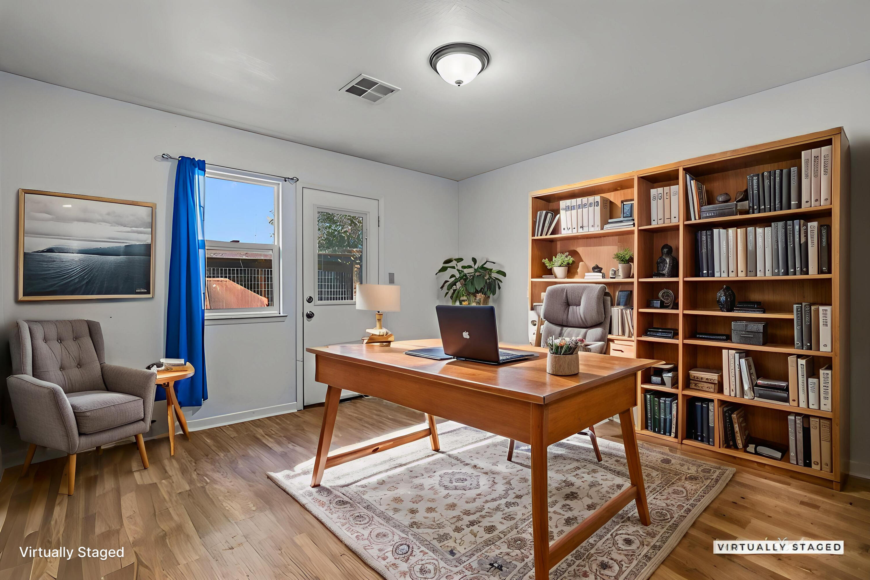 4218 Jane Street Redding, CA 96002 - Photo 30 of 50 a view of a workspace with furniture and a bookshelf