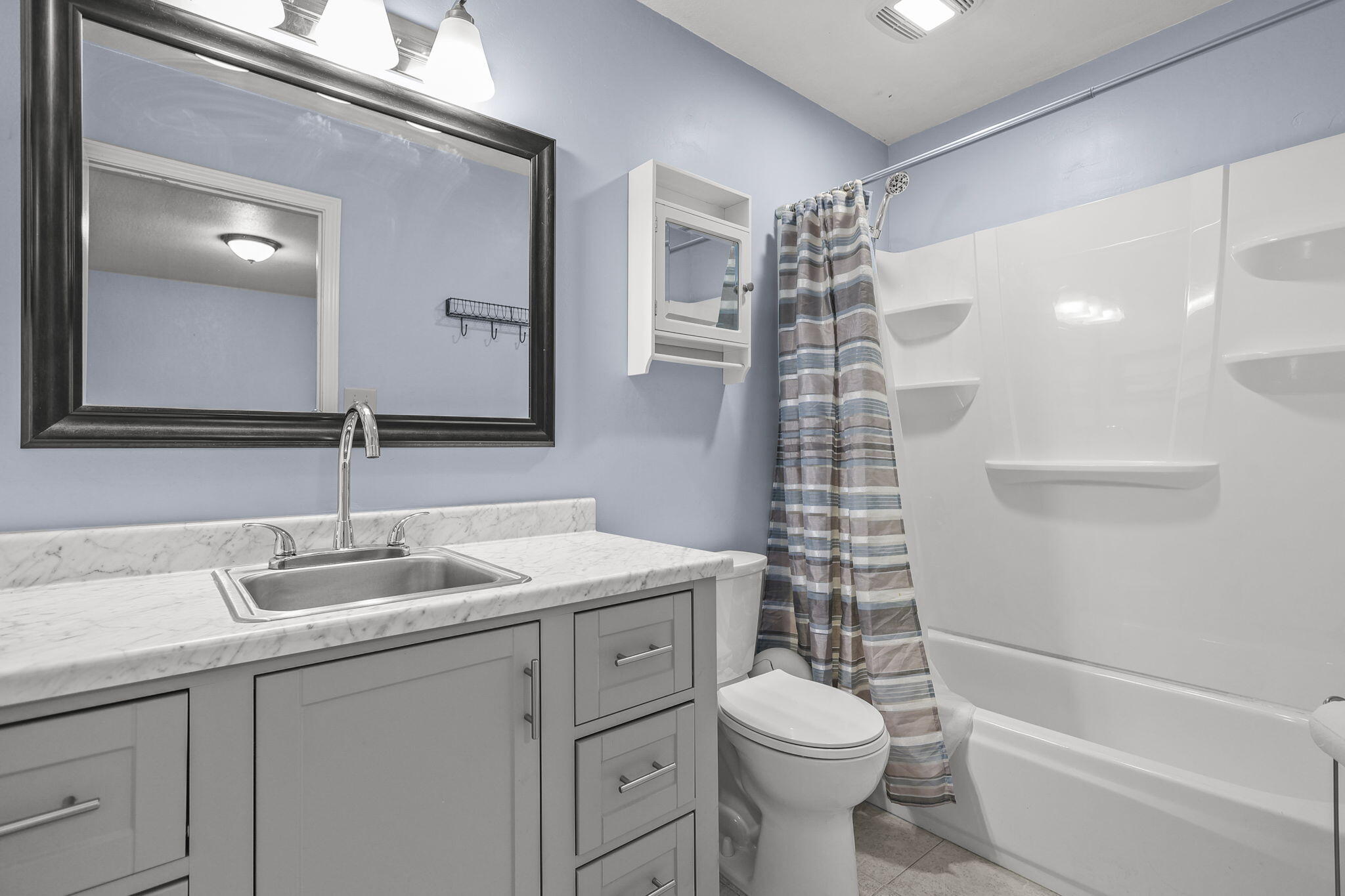 4218 Jane Street Redding, CA 96002 - Photo 34 of 50 a bathroom with a sink a toilet and shower