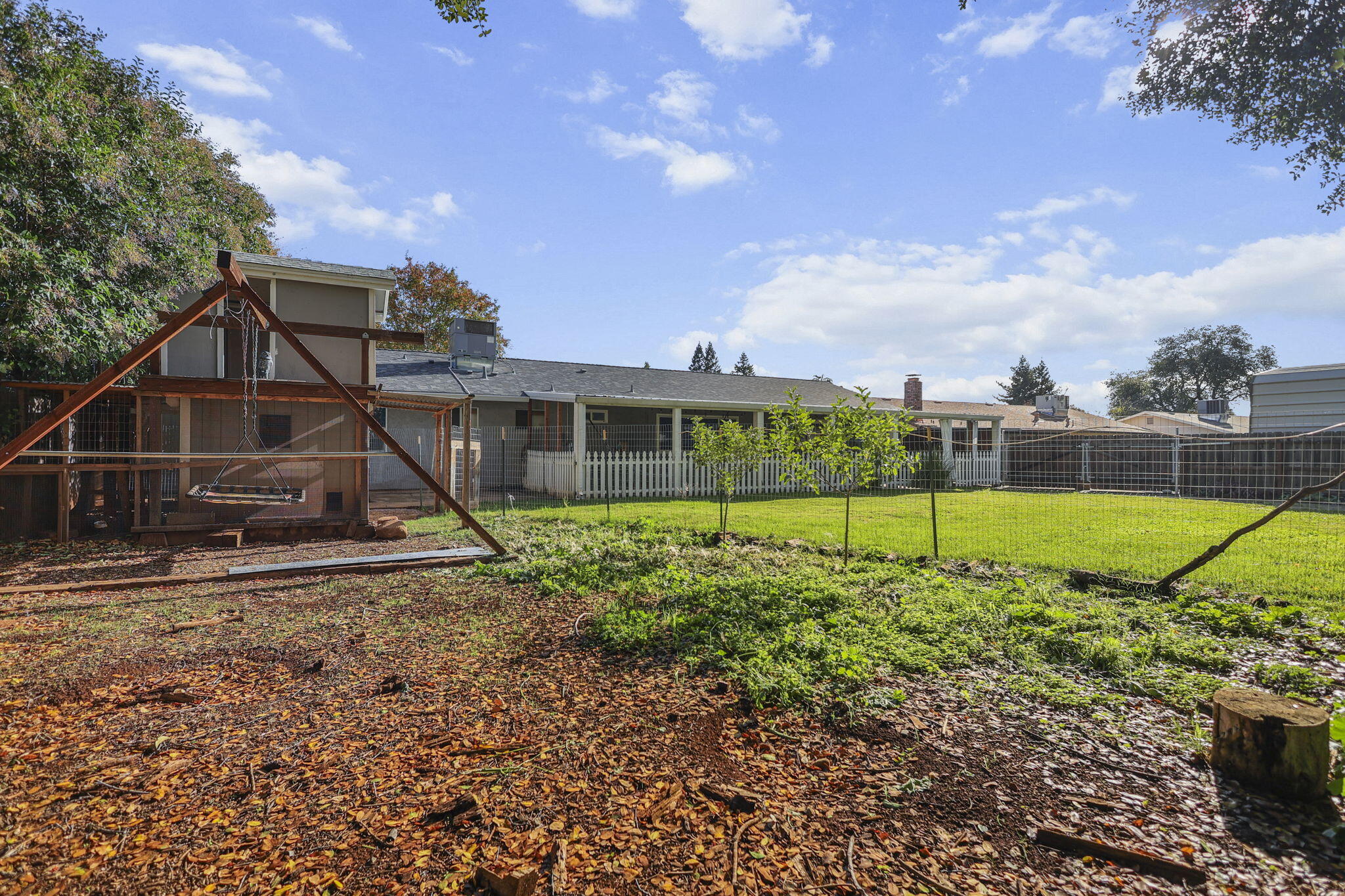 4218 Jane Street Redding, CA 96002 - Photo 40 of 50 a view of a house with a backyard