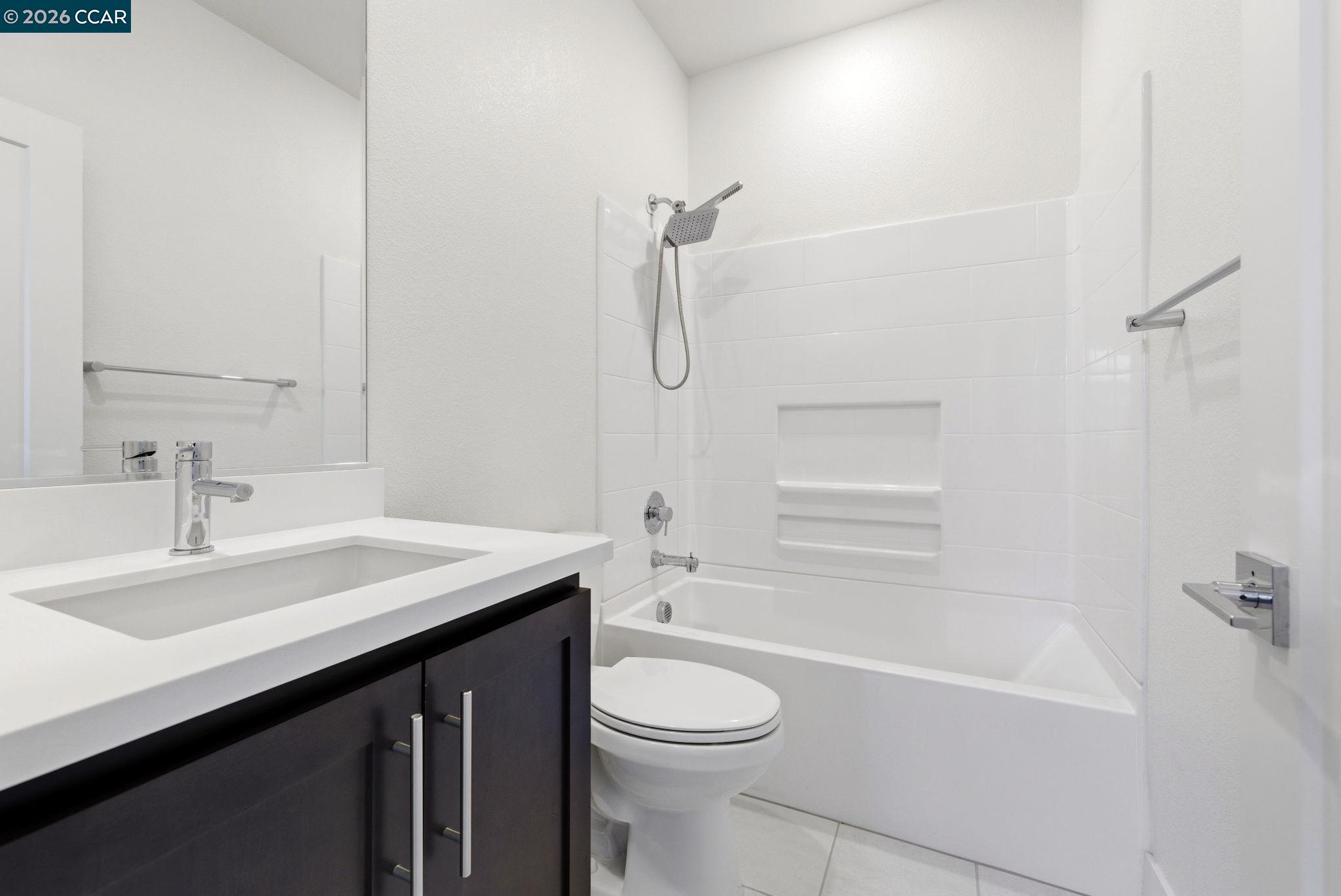 205 Plum Tree Street Livermore, CA 94551 - Photo 42 of 47 a bathroom with a sink a toilet and shower