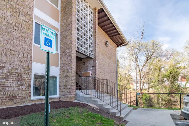 a pathway of a house with a yard