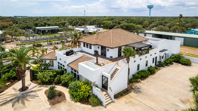 an aerial view of a house with a garden