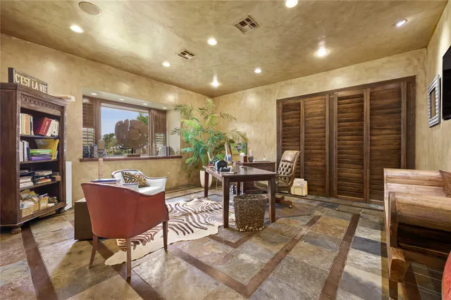 a view of a workspace with furniture and a livingroom