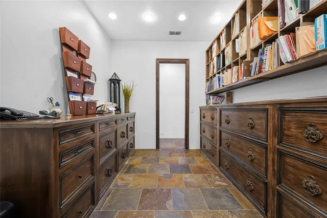 a bathroom with a sink toilet and a mirror