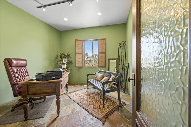 a workspace with furniture window and wooden floor