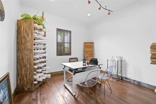 a workspace with furniture and a potted plant