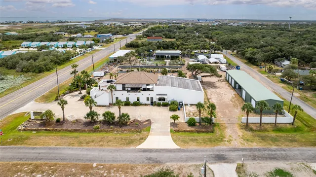 an aerial view of a house with a garden