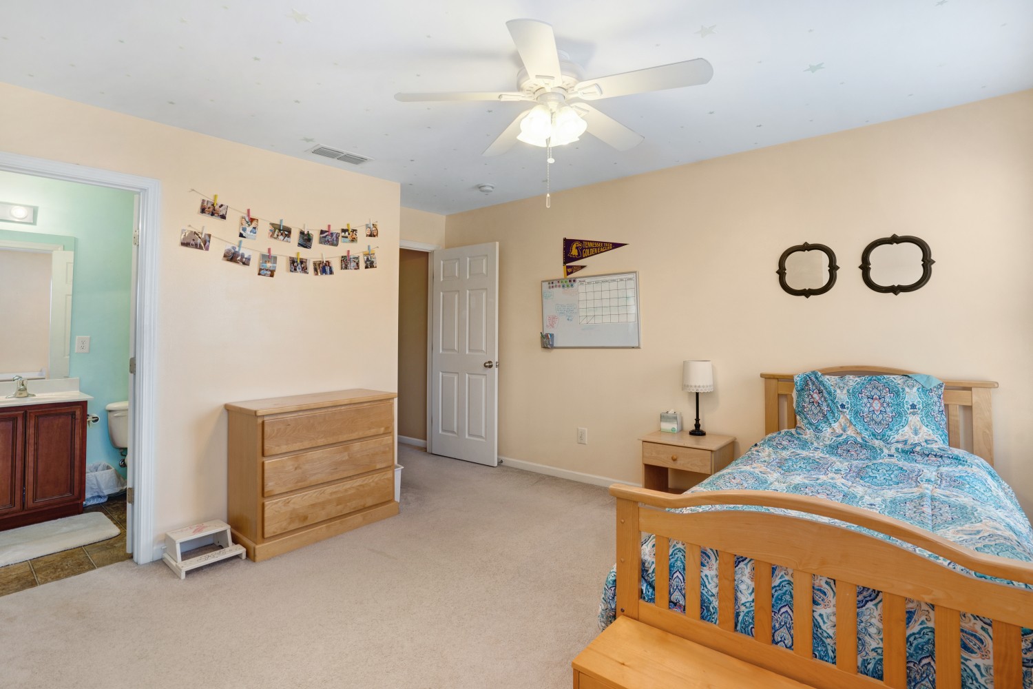 4078 Locerbie Circle Spring Hill, TN 37174 - Photo 22 of 40 a bedroom with furniture and a chandelier