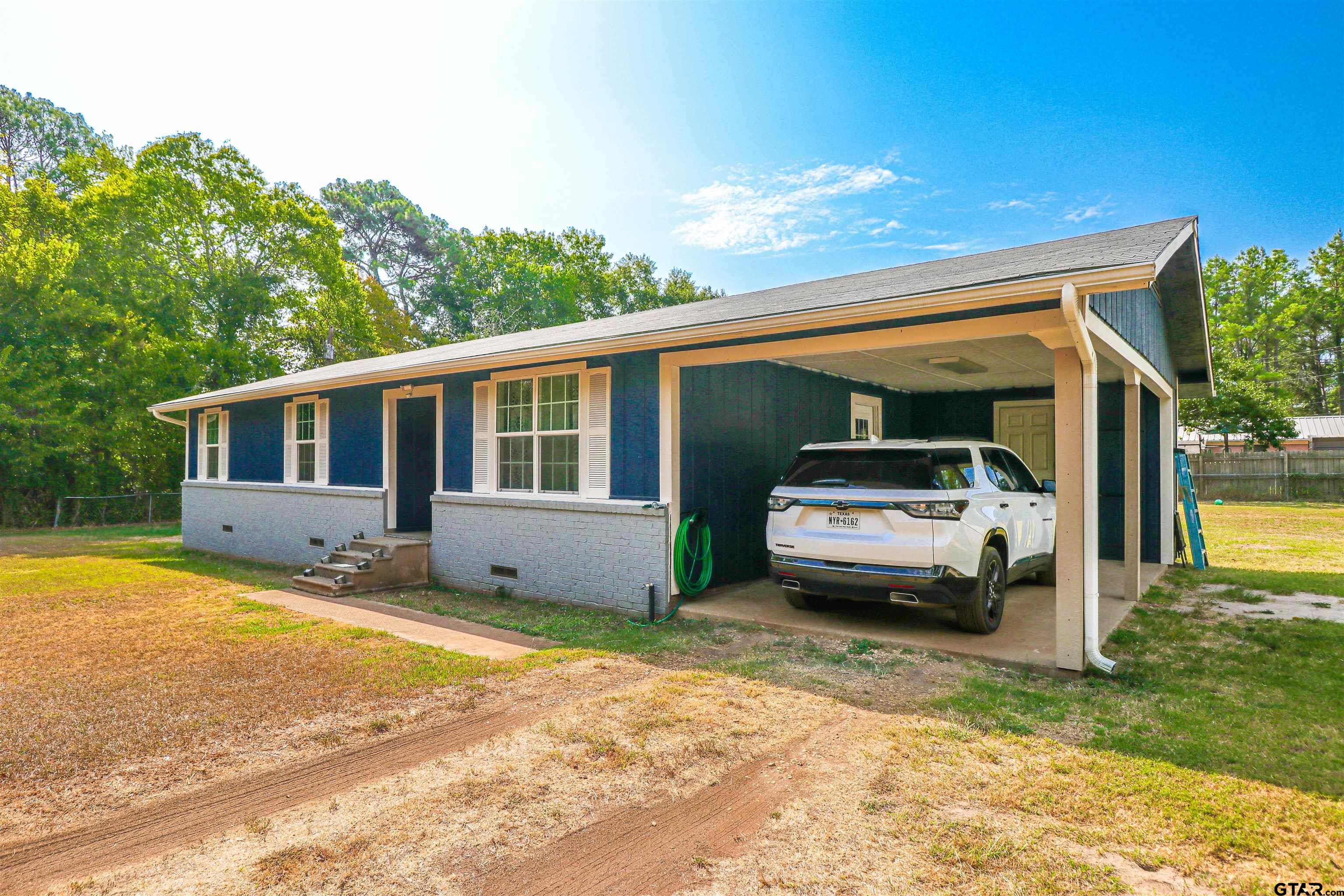 140 County Road 1541 Rusk, TX 75785 - Photo 1 of 21 a car parked in front of a house