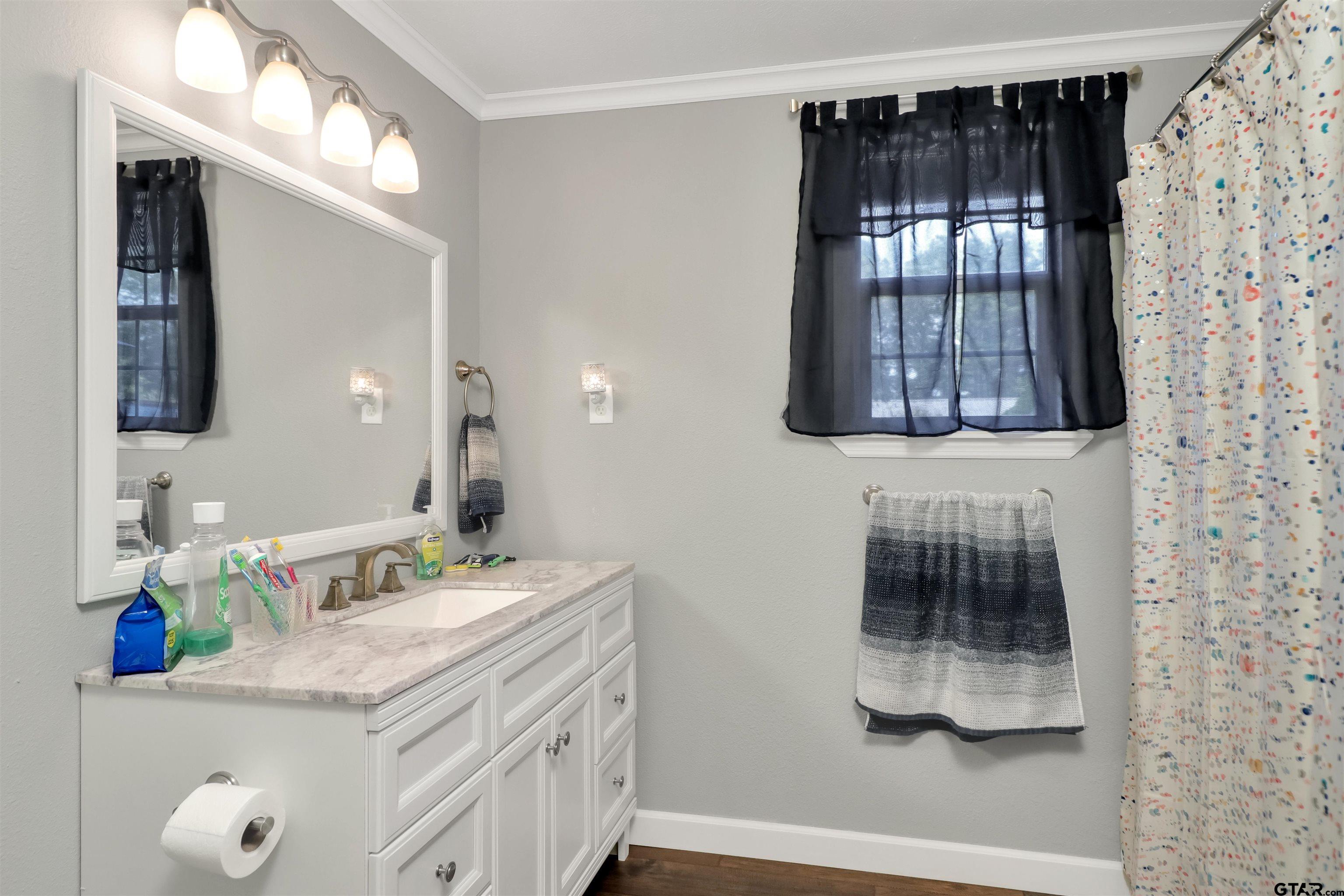140 County Road 1541 Rusk, TX 75785 - Photo 12 of 21 a bathroom with a sink and a mirror