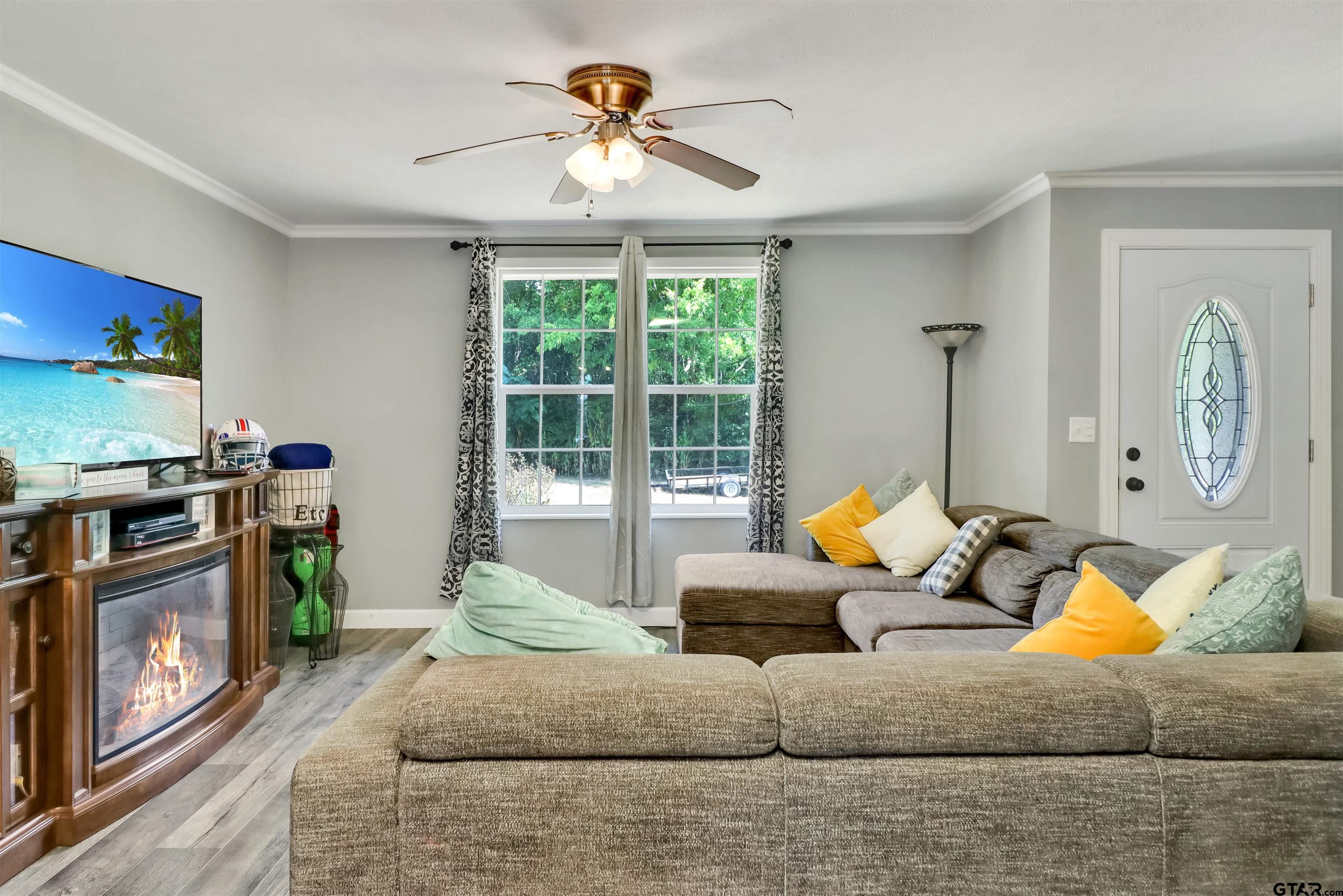 140 County Road 1541 Rusk, TX 75785 - Photo 13 of 21 a living room with furniture and a fireplace