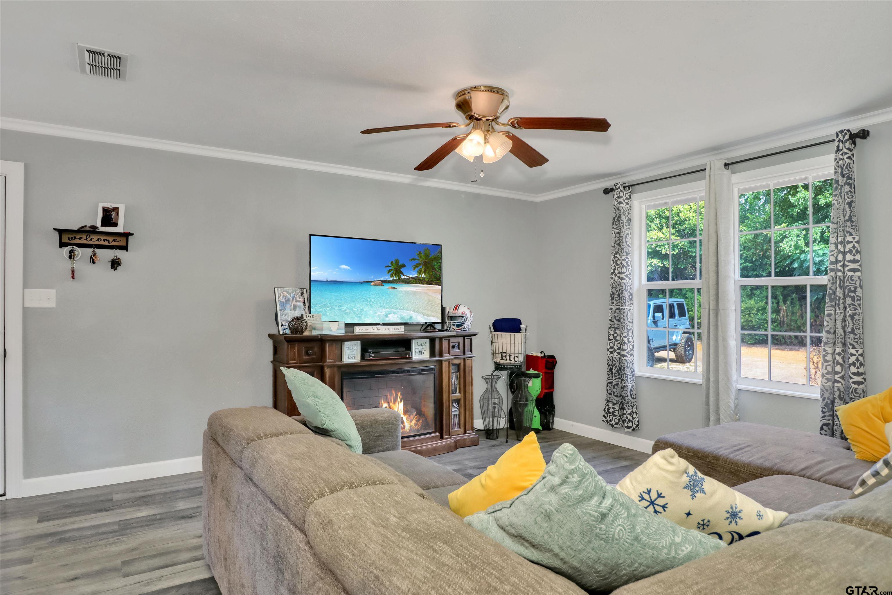 140 County Road 1541 Rusk, TX 75785 - Photo 14 of 21 a living room with furniture and a flat screen tv