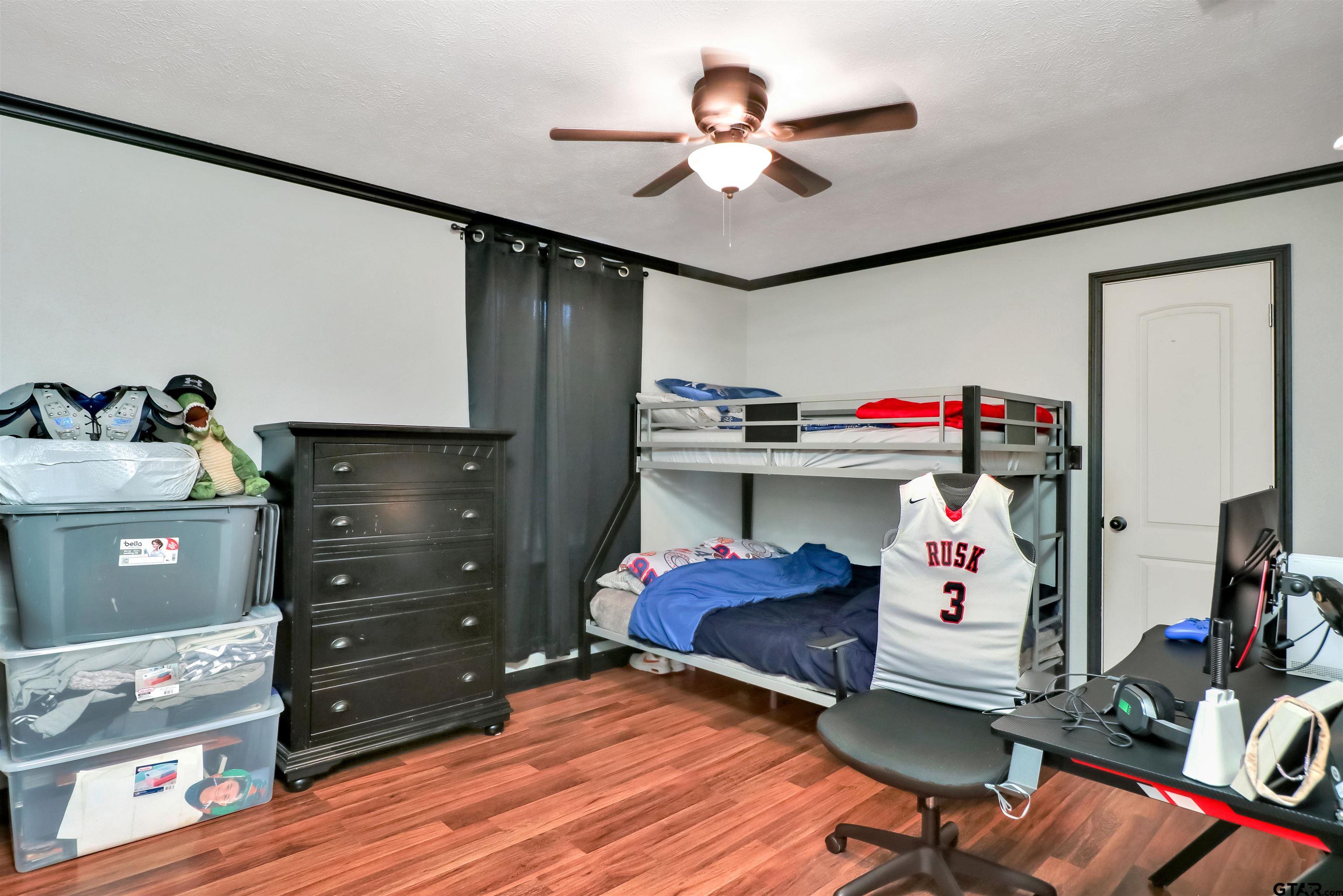 140 County Road 1541 Rusk, TX 75785 - Photo 5 of 21 a living room with hard wood flooring and a couch