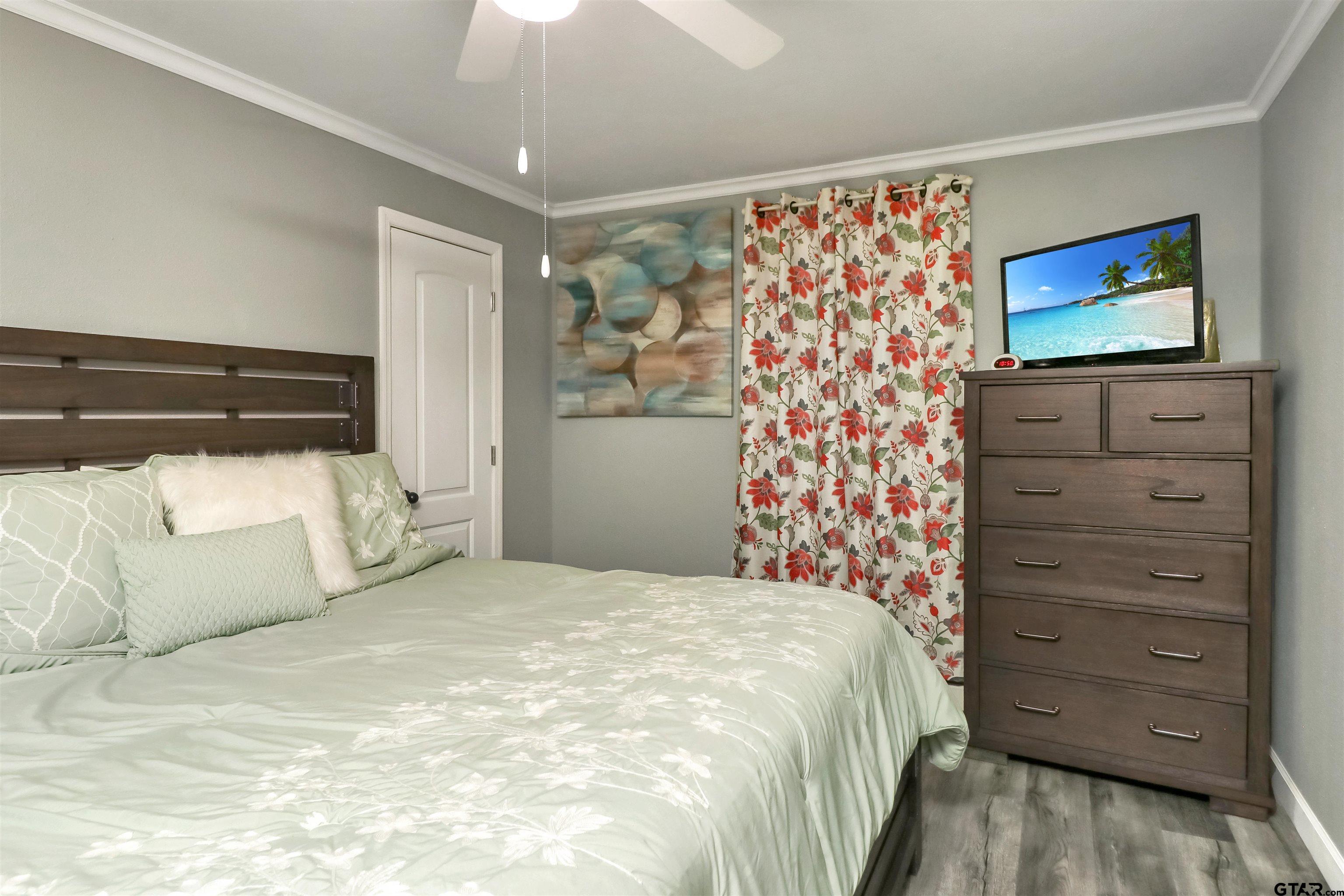 140 County Road 1541 Rusk, TX 75785 - Photo 8 of 21 a bedroom with a bed and a dresser