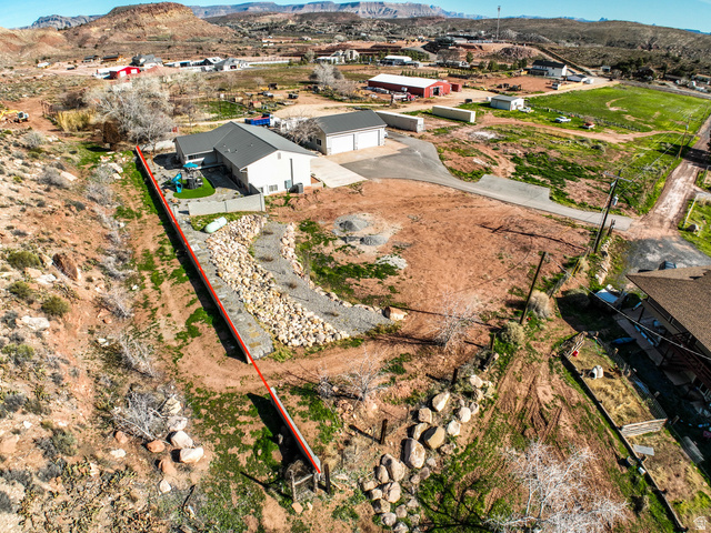 422 West Buckeye Reef Road Leeds, UT 84746 - Photo 11 of 47 Aerial view of residential area featuring a mountain backdrop