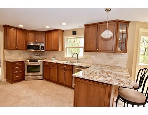 25 Azalea Road Sharon, MA 02067 - Photo 4 of 21 a kitchen with stainless steel appliances granite countertop a stove top oven a sink dishwasher and a microwave oven on the blue kitchen countertops