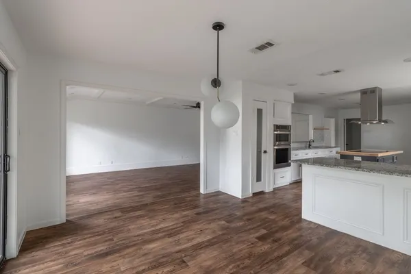 a kitchen with stainless steel appliances a refrigerator sink and microwave