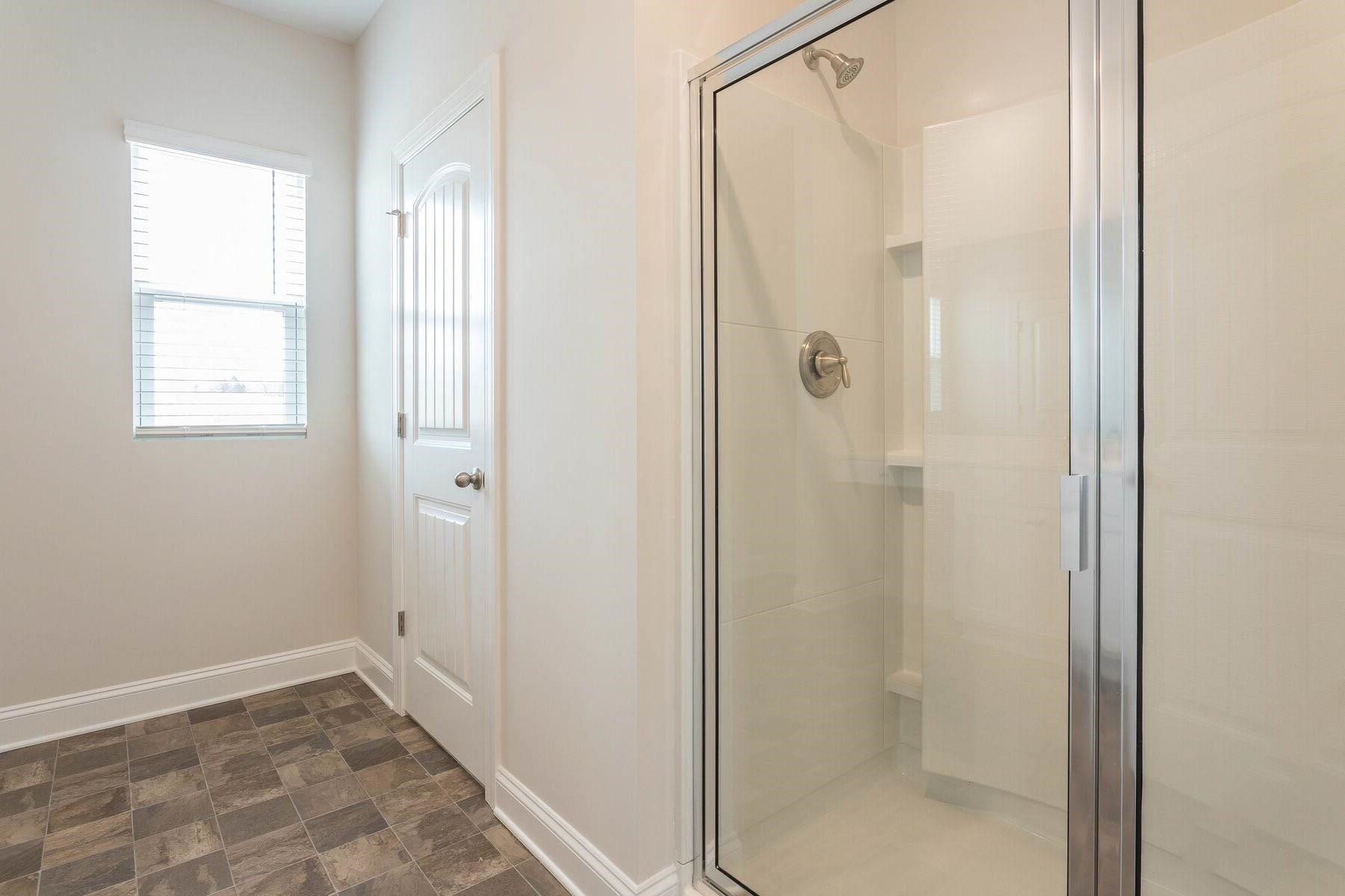 310 Access Drive Youngsville, NC 27596 - Photo 13 of 19 a bathroom with a shower