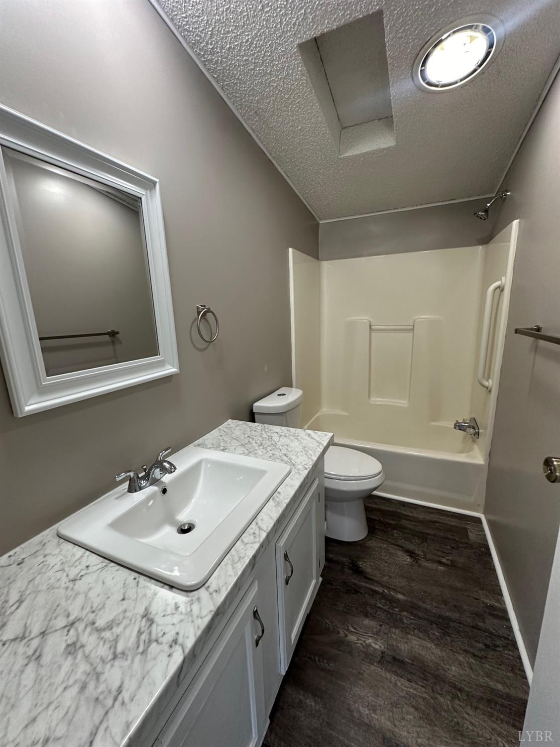 6337 Bethany Road Rustburg, VA 24588 - Photo 16 of 24 a bathroom with a sink a toilet and shower