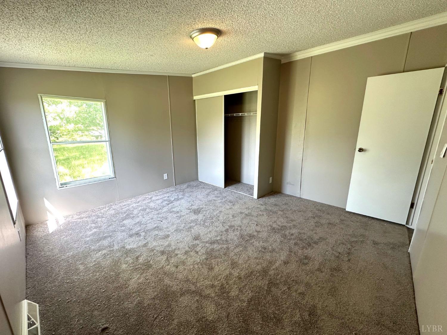 6337 Bethany Road Rustburg, VA 24588 - Photo 19 of 24 a view of an empty room and a window