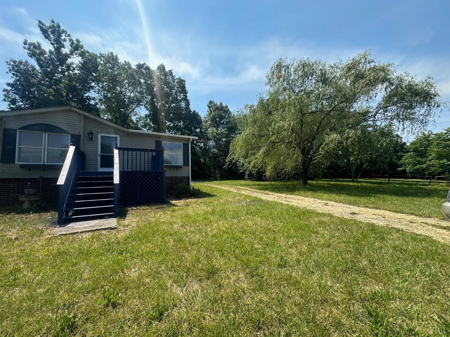 6337 Bethany Road Rustburg, VA 24588 - Photo 20 of 24 a view of a house with backyard and a garden