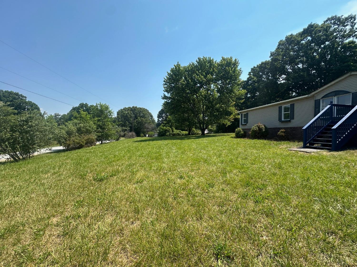 6337 Bethany Road Rustburg, VA 24588 - Photo 2 of 24 a backyard of a house with lots of green space