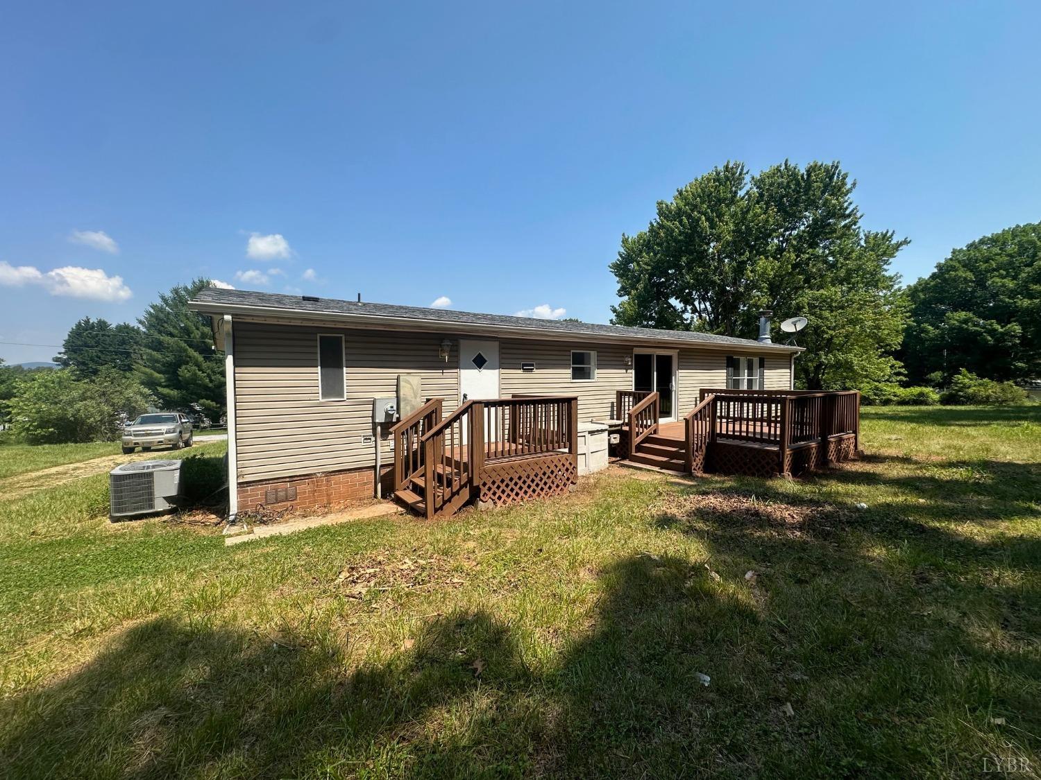 6337 Bethany Road Rustburg, VA 24588 - Photo 21 of 24 a view of a house with backyard and sitting area