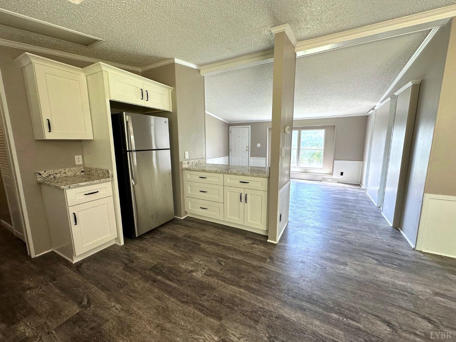 6337 Bethany Road Rustburg, VA 24588 - Photo 8 of 24 a kitchen with stainless steel appliances a refrigerator and a sink