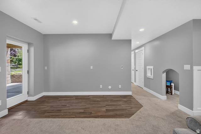 1263 East 1200th South Springville, UT 84663 - Photo 36 of 60 Finished lower level featuring recessed lighting, wood-finish flooring, and a glass-paneled exterior door