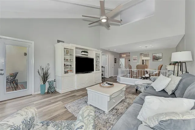 a kitchen with a refrigerator stove and white cabinets
