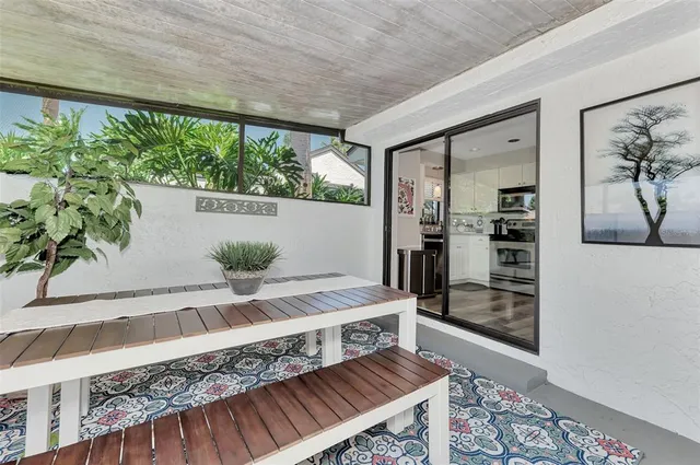 a view of a living room with furniture and a clock