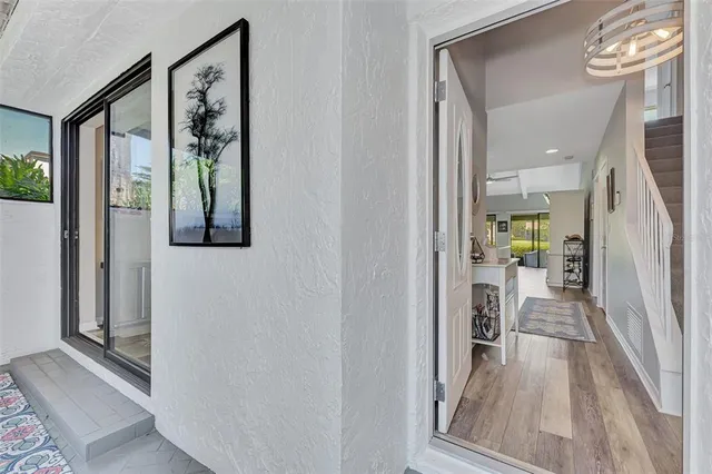 a bathroom with a toilet a sink a mirror and vanity