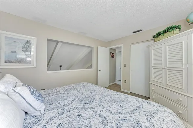 a view of a sign board with tall buildings