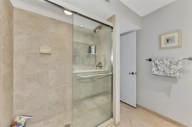 an aerial view of a houses with a yard