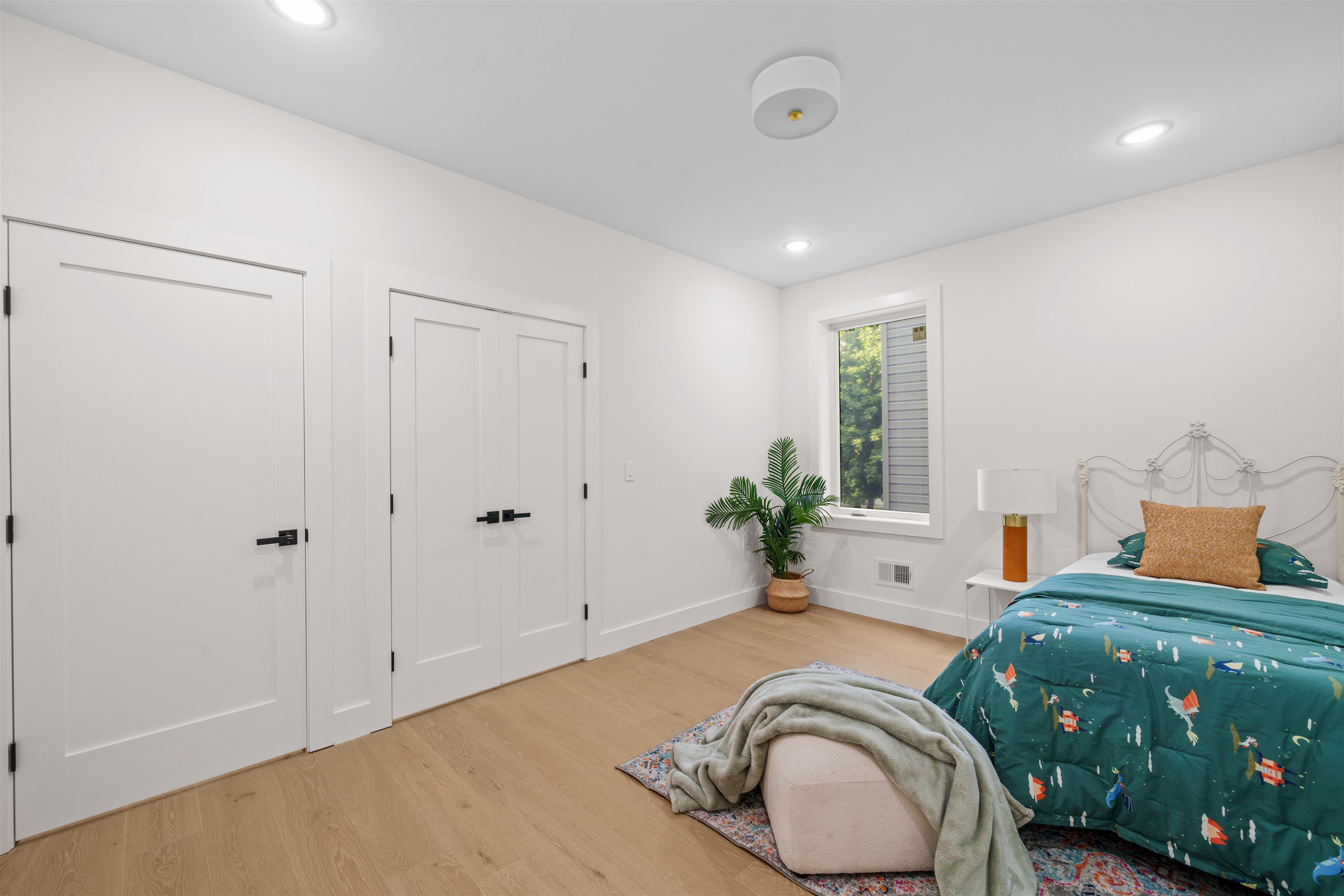 249.5 Halladay Street, Unit 1 Jersey City, NJ 07304 - Photo 21 of 31 a bedroom with a bed and a chair