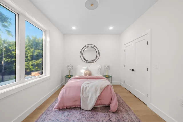 a bed room with a bed and a window